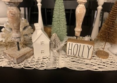 Kitchen decorated for the holidays with greenery and ribbon